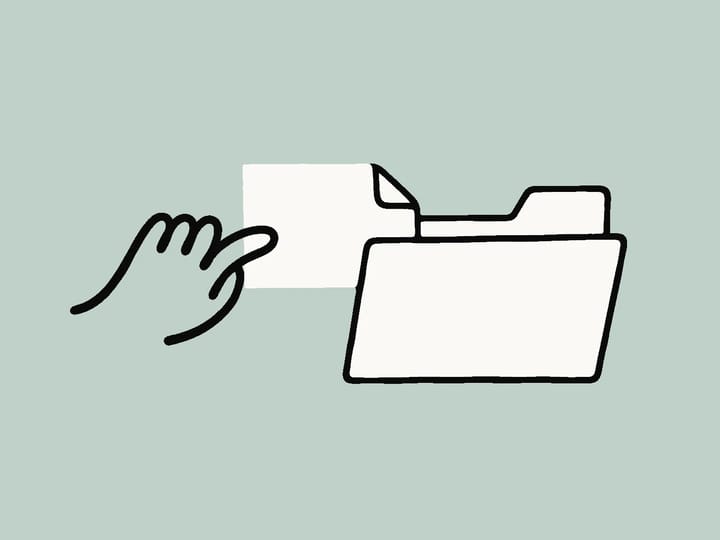 Hand sliding a Skill card into an open folder